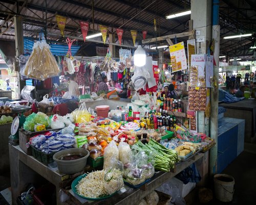 A vibrant local Thai fresh market with vegetables neatly arranged